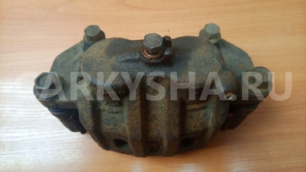 Суппорт тормозной передний левый Mitsubishi Mitsubishi i оригинальный номер MR370775