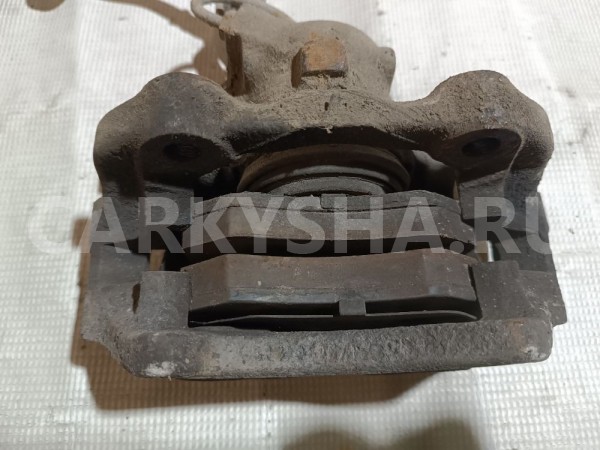 Суппорт тормозной передний левый Volkswagen Passat 