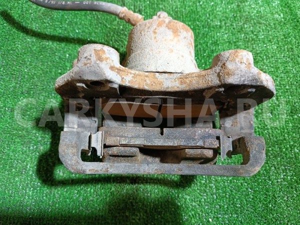 Суппорт тормозной передний левый Nissan Avenir 