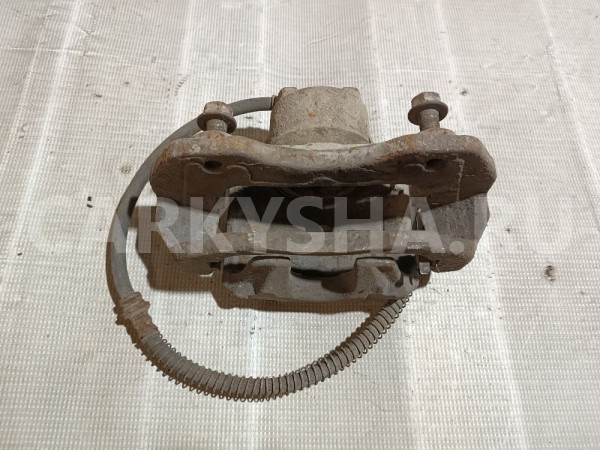 Суппорт тормозной передний левый Mitsubishi Lancer 